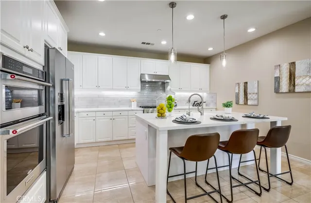a living room with furniture a window and a table