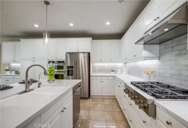 a bathroom with a double vanity sink toilet and shower