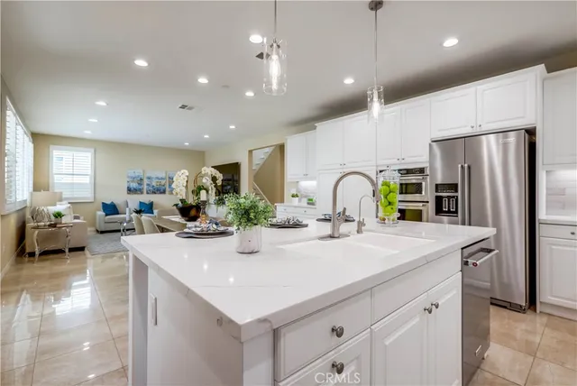 a living room with furniture and large windows
