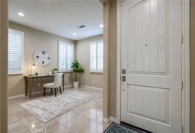 a view of staircase with white walls and a window