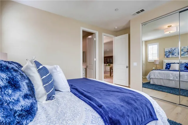 a spacious bathroom with a tub a sink and a window