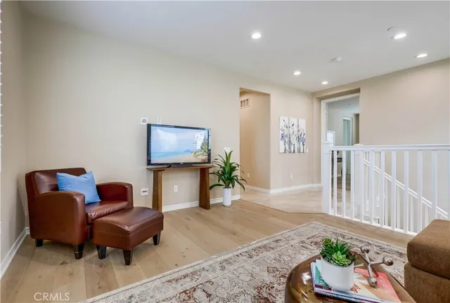 a bathroom with a toilet a sink and a large mirror
