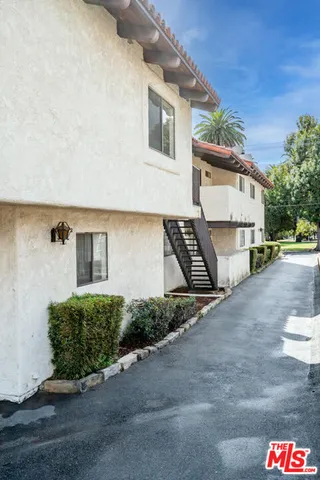 a front view of a house with parking space