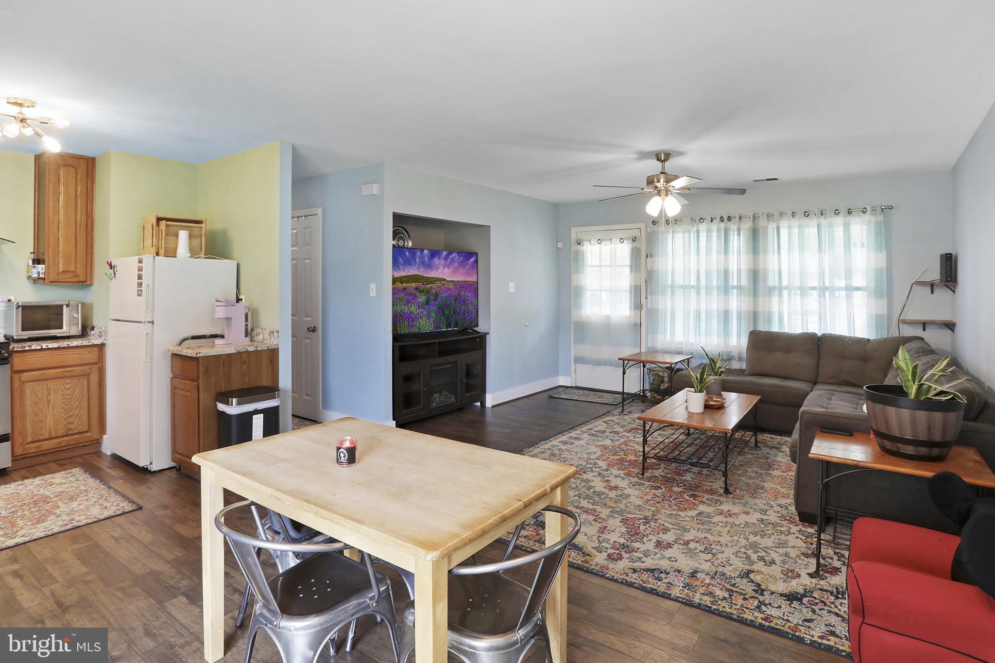 402 Williamsburg Road Sterling, VA 20164 - Photo 11 of 28 kitchen with table space and open to living room.