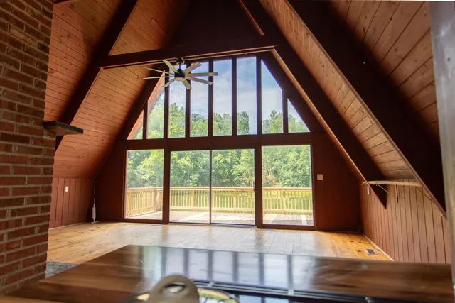 a view of an empty room with a balcony