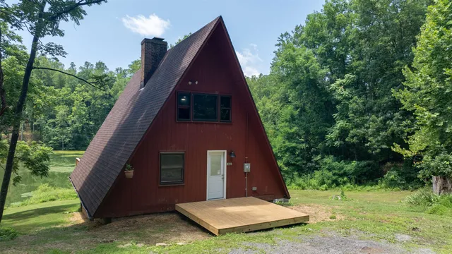 a view of a large brick house with a yard
