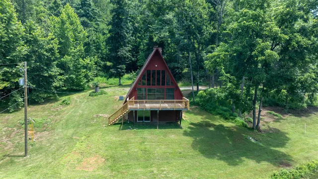 a view of a backyard with a small cabin