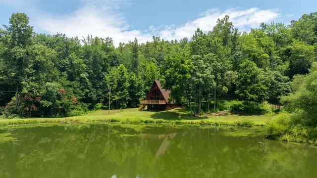 a view of balcony with wooden floor and fence