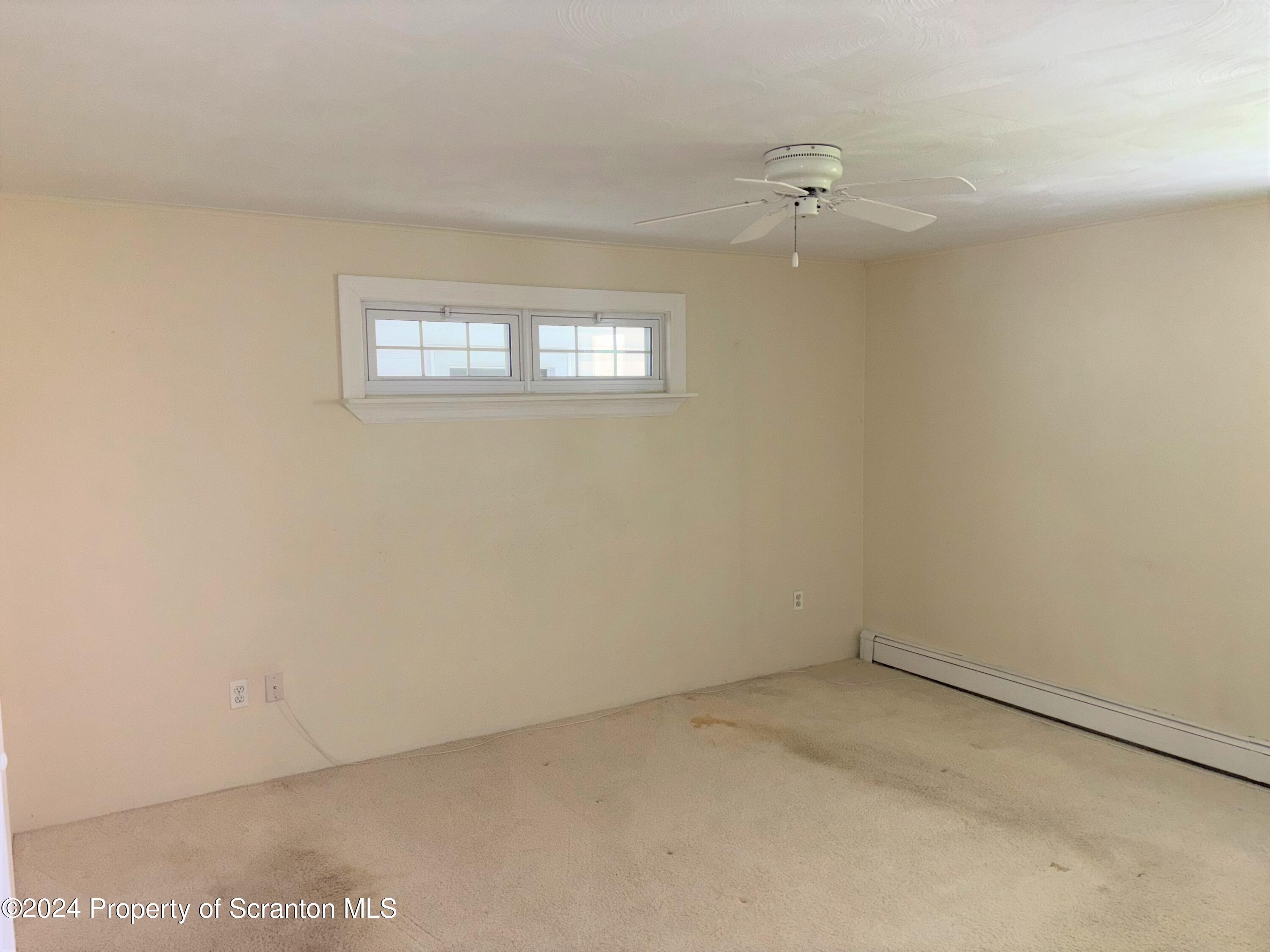 1402 Cherry Street Scranton, PA 18505 - Photo 12 of 25 wooden floor and window in an empty room