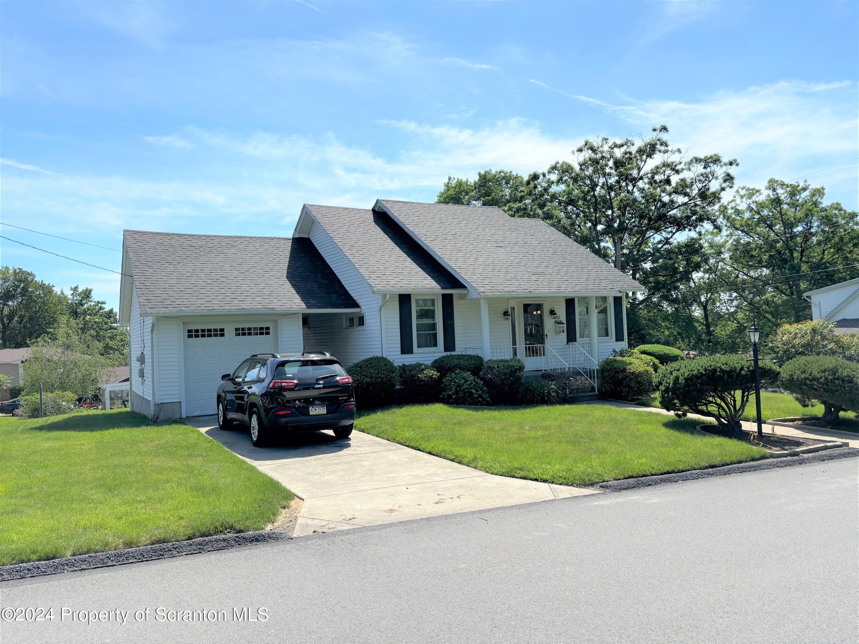 1402 Cherry Street Scranton, PA 18505 - Photo 2 of 25 a house view with a garden space