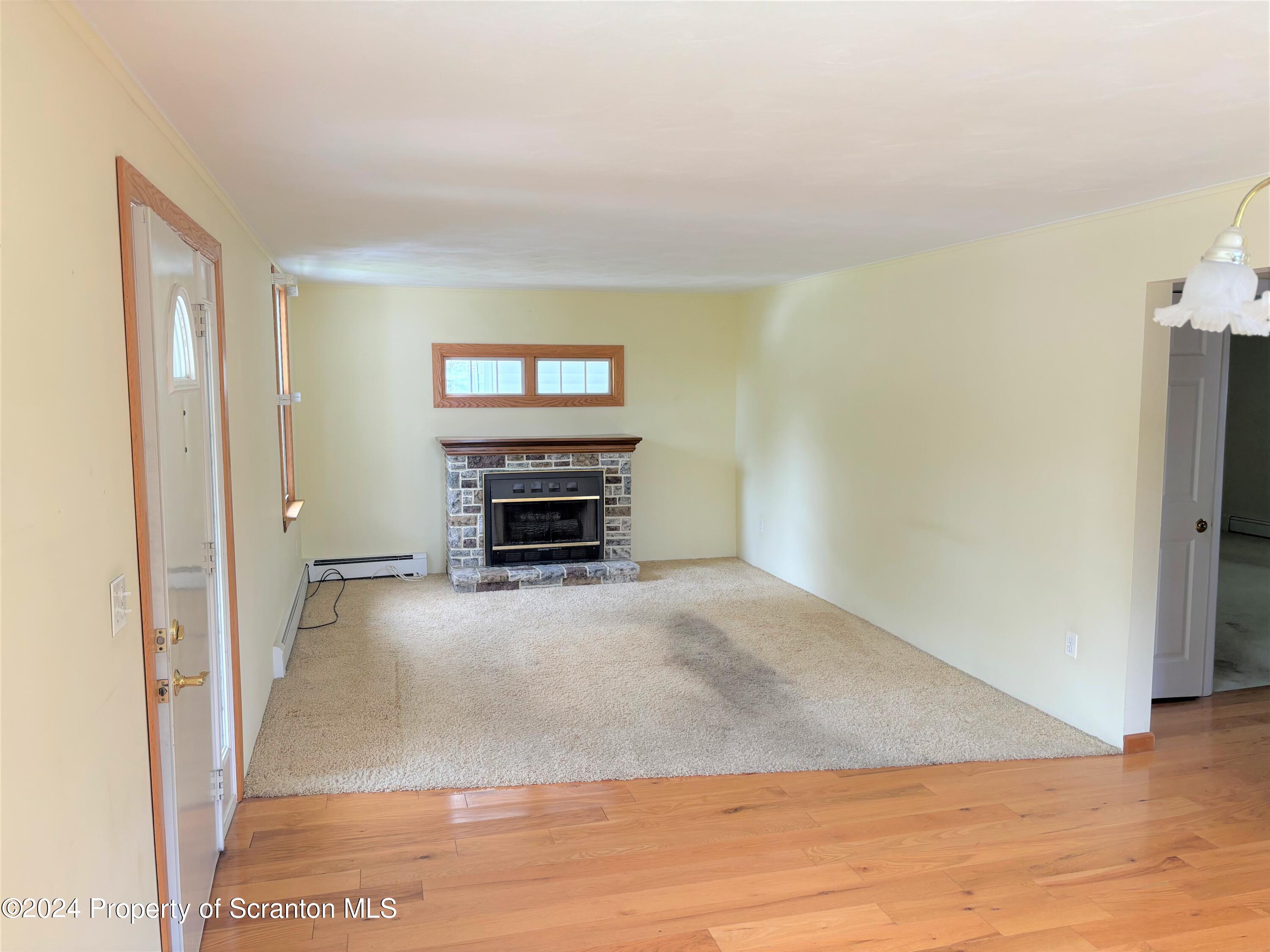 1402 Cherry Street Scranton, PA 18505 - Photo 9 of 25 a view of livingroom with furniture and fireplace