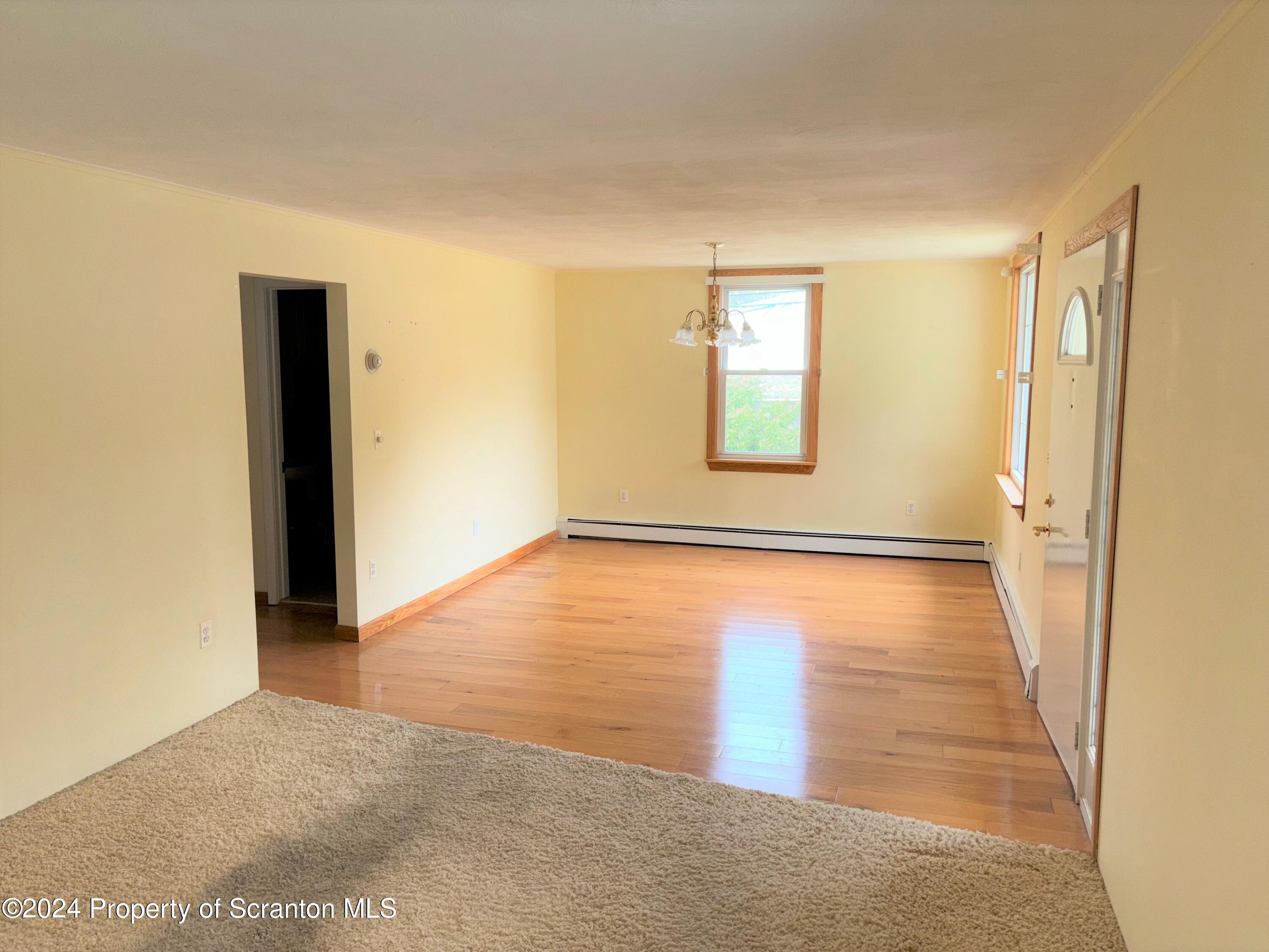 1402 Cherry Street Scranton, PA 18505 - Photo 10 of 25 an empty room with windows and closet