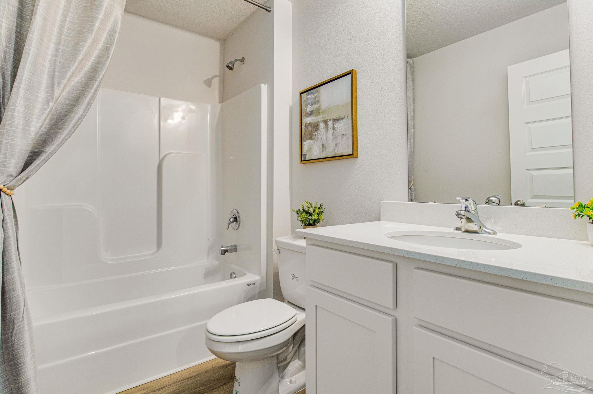 2689 Chevy Circle Pace, FL 32571 - Photo 19 of 26 a bathroom with a sink toilet and shower