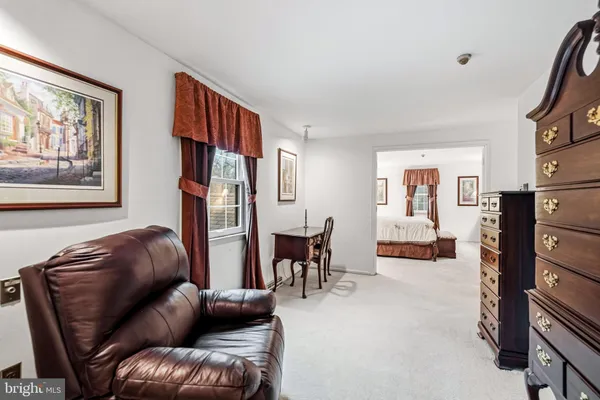a view of a livingroom with furniture and a window
