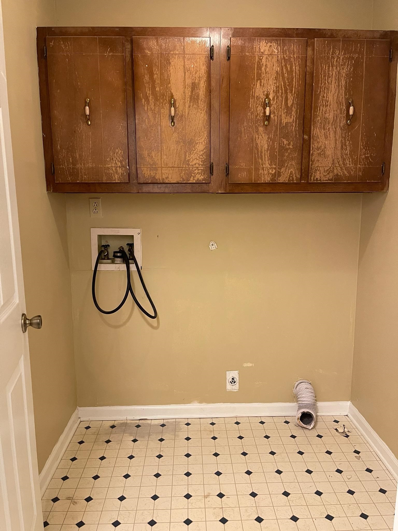 1199 McQuiston Road Brighton, TN 38011 - Photo 15 of 16 Laundry area featuring cabinets, washer hookup, and electric dryer hookup