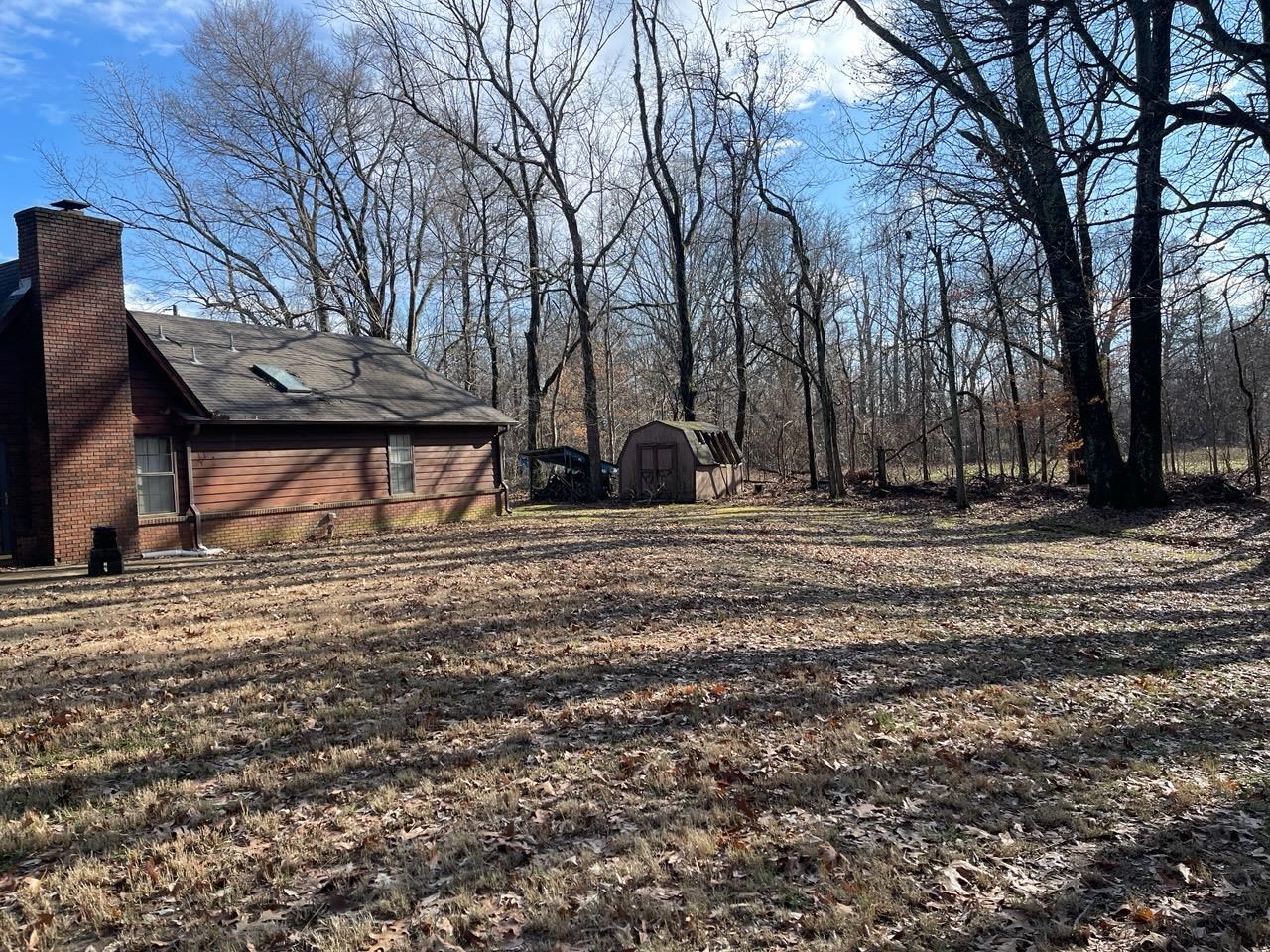 1199 McQuiston Road Brighton, TN 38011 - Photo 5 of 16 View of yard featuring a shed