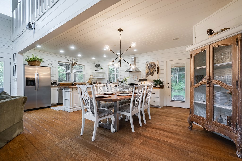 328 Black Ankle Creek Road Cherry Log, GA 30522 - Photo 13 of 103 a dining room with furniture a kitchen view and wooden floor
