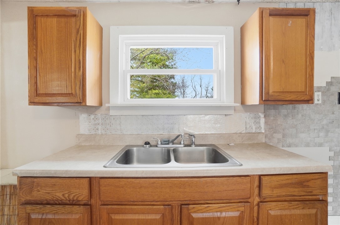 1166 West Sparrow Road Springfield, OH 45502 - Photo 21 of 40 This kitchen offers ample cabinetry and a practical sink area with a view.