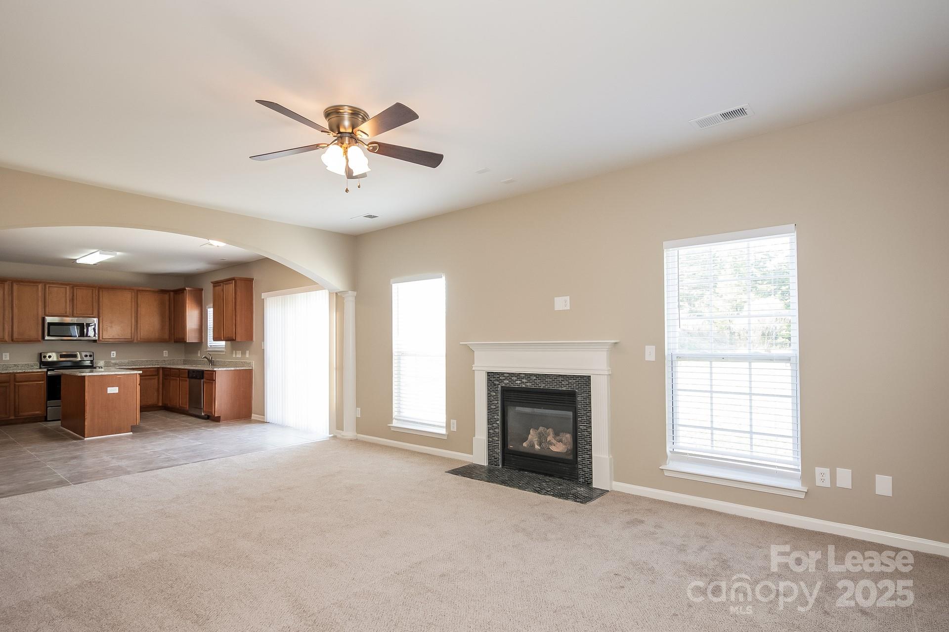 11528 Sidney Crest Avenue Charlotte, NC 28213 - Photo 3 of 15 a living room with furniture and a fireplace