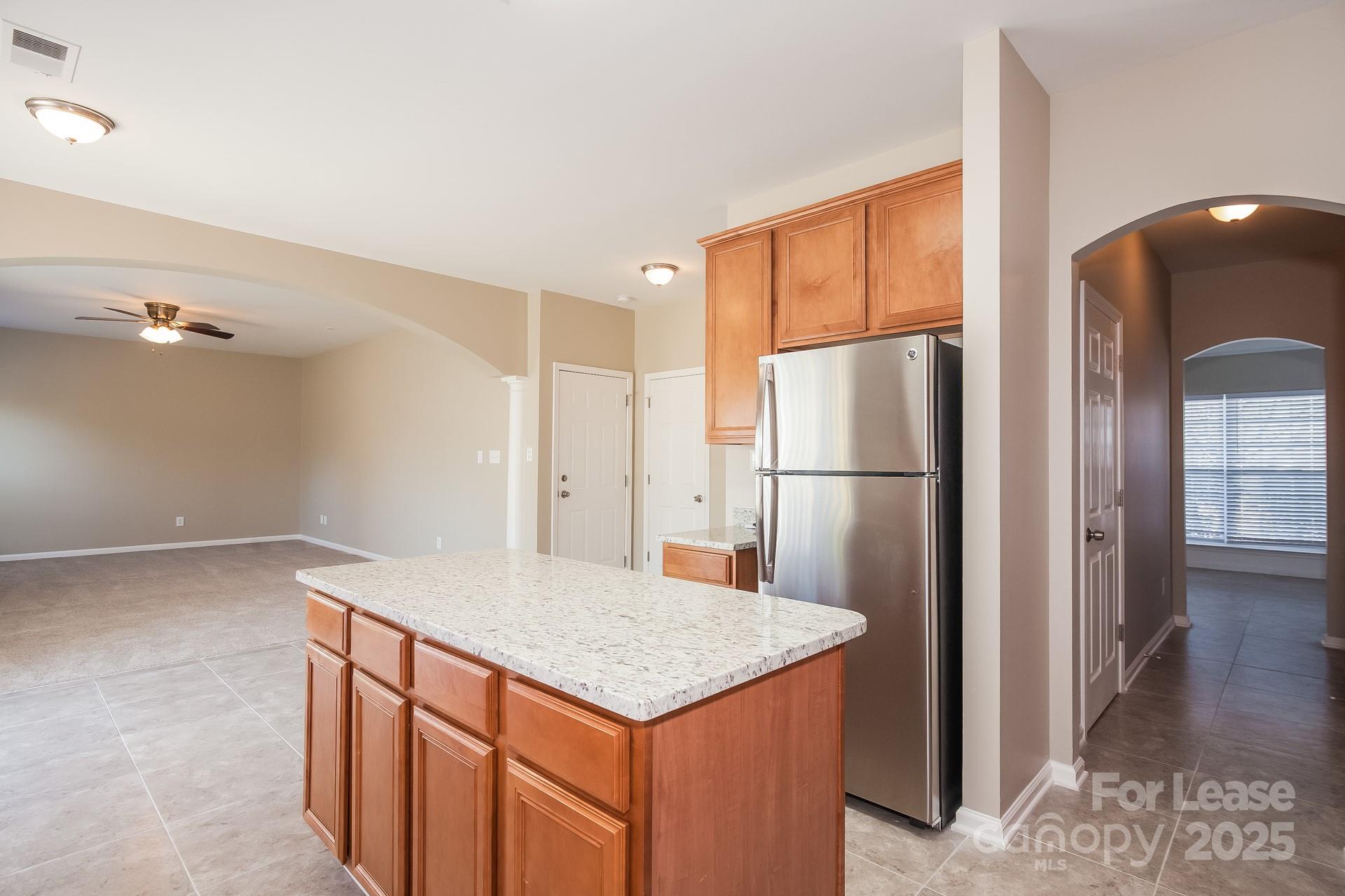 11528 Sidney Crest Avenue Charlotte, NC 28213 - Photo 6 of 15 a kitchen with stainless steel appliances a refrigerator and a sink