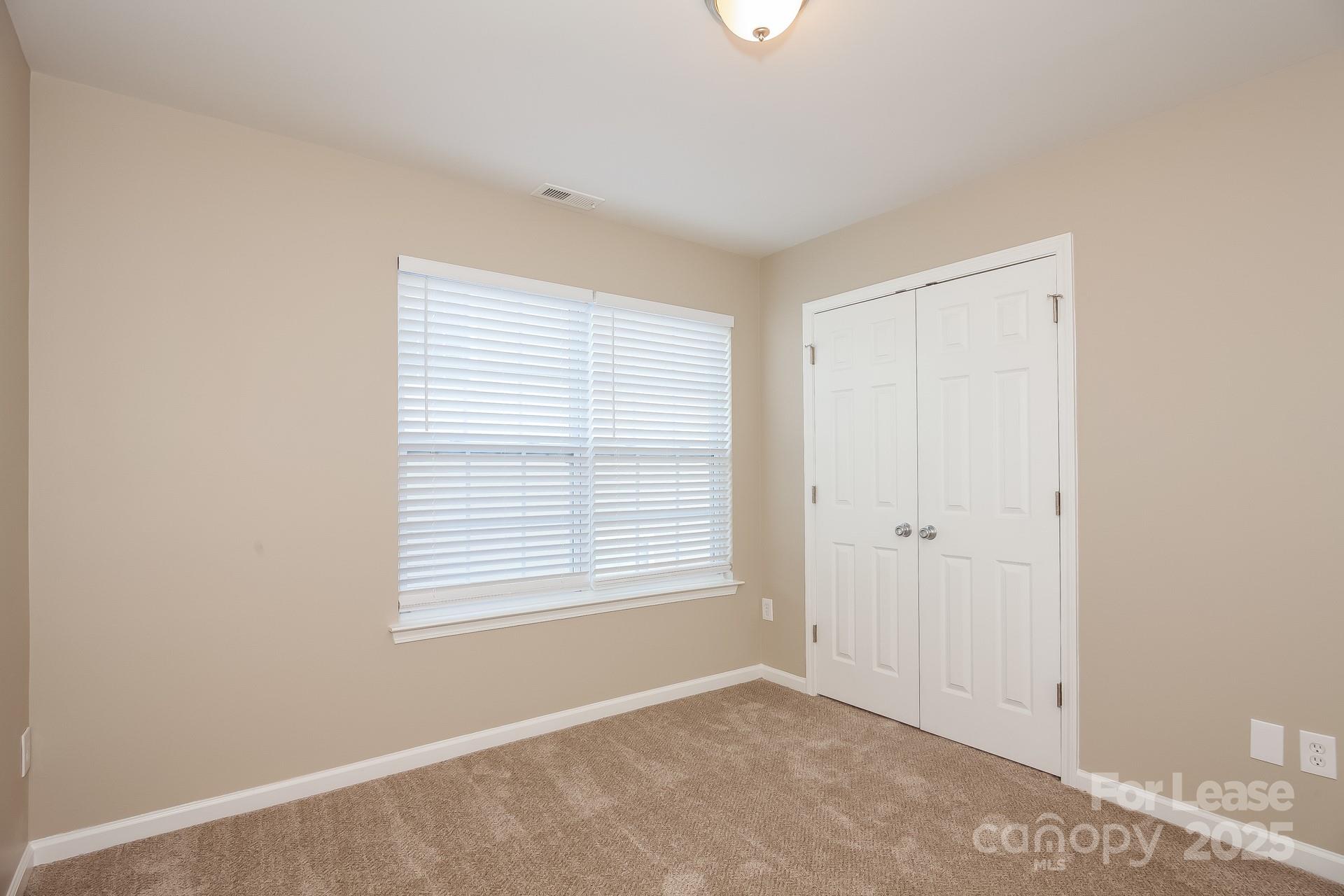 11528 Sidney Crest Avenue Charlotte, NC 28213 - Photo 10 of 15 a view of an empty room with a window