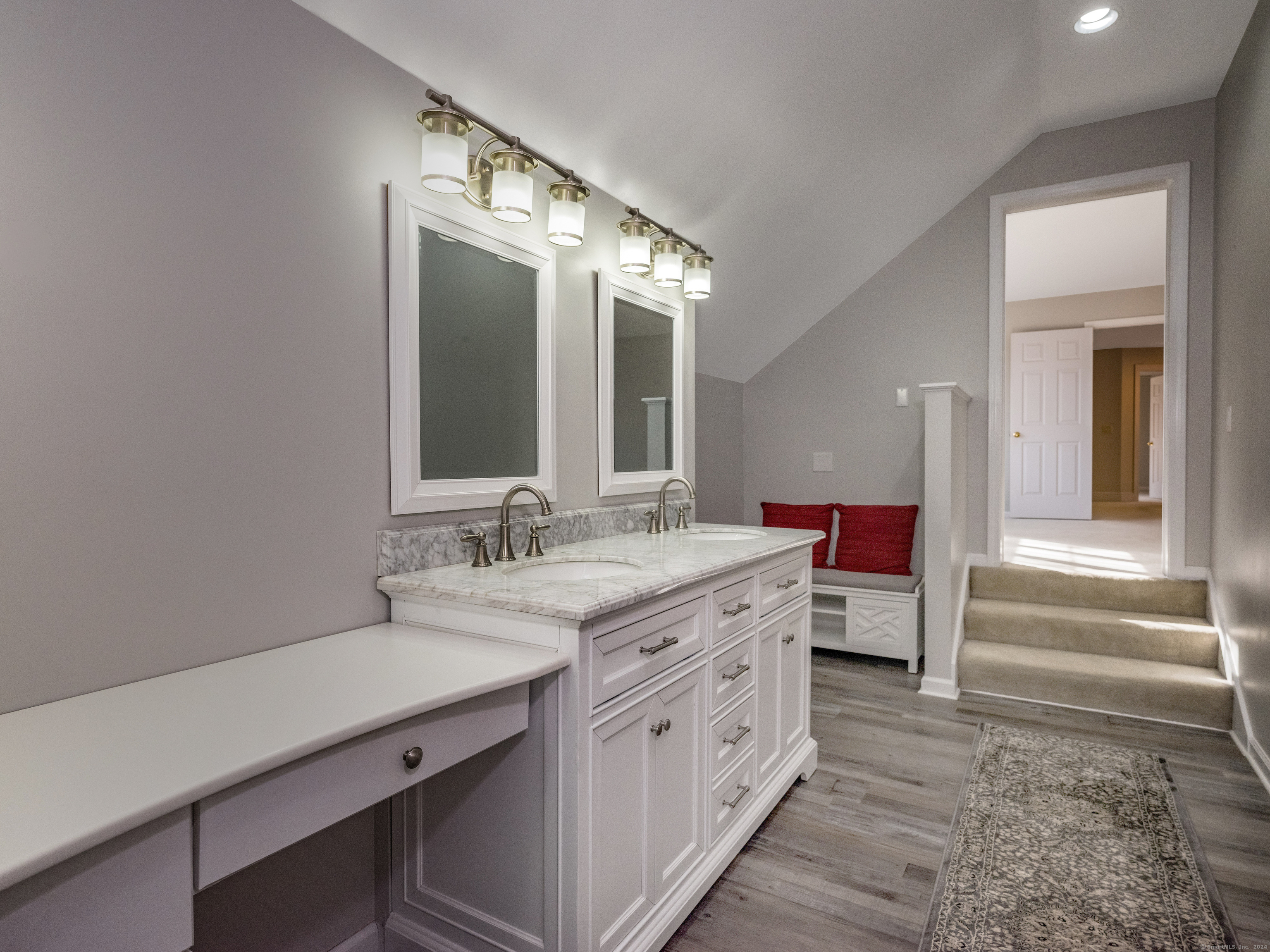 13 Longview Terrace, Unit 13 Madison, CT 06443 - Photo 15 of 31 a spacious bathroom with a double vanity sink and a mirror