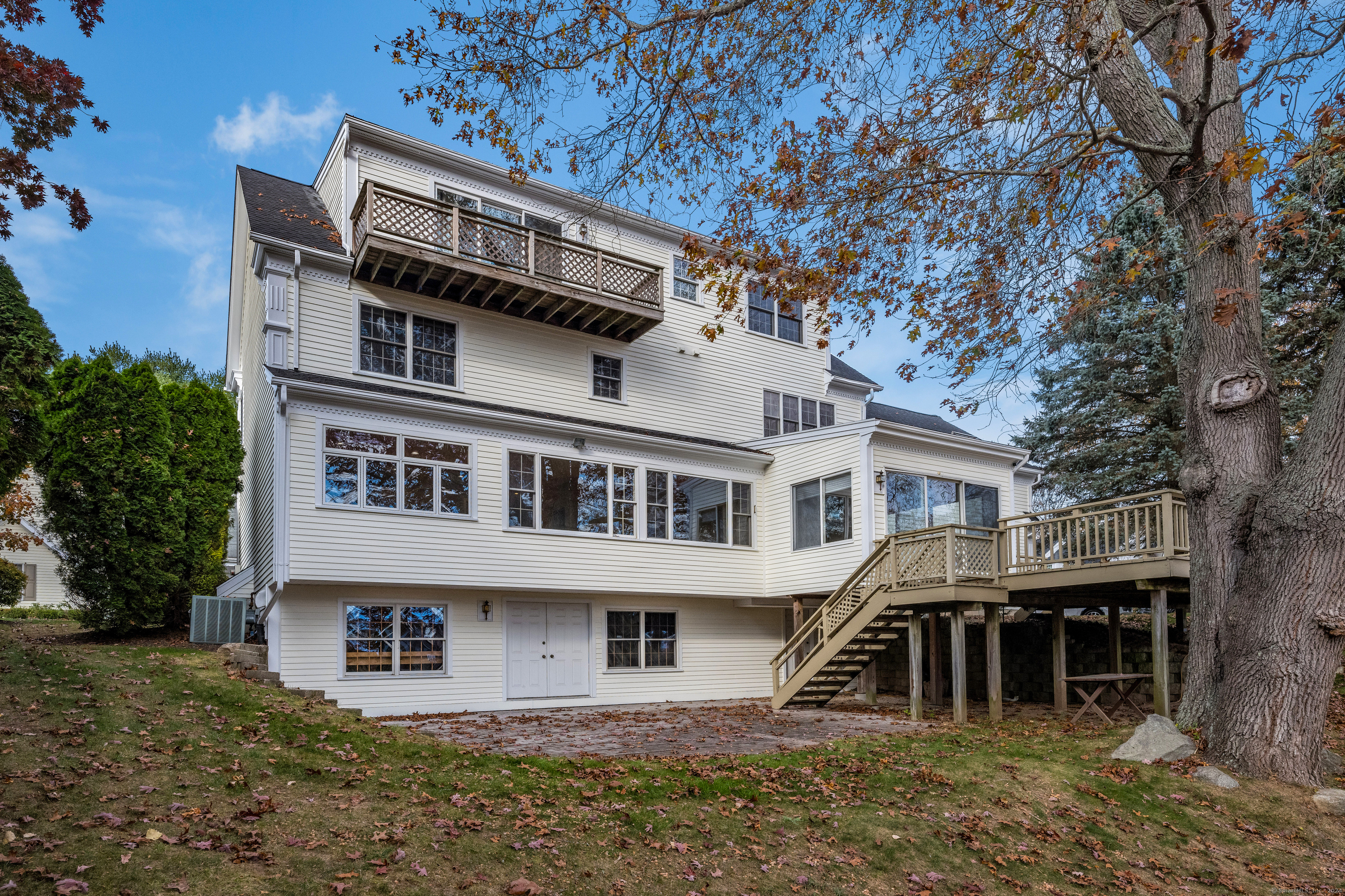 13 Longview Terrace, Unit 13 Madison, CT 06443 - Photo 25 of 31 a front view of a house with a yard