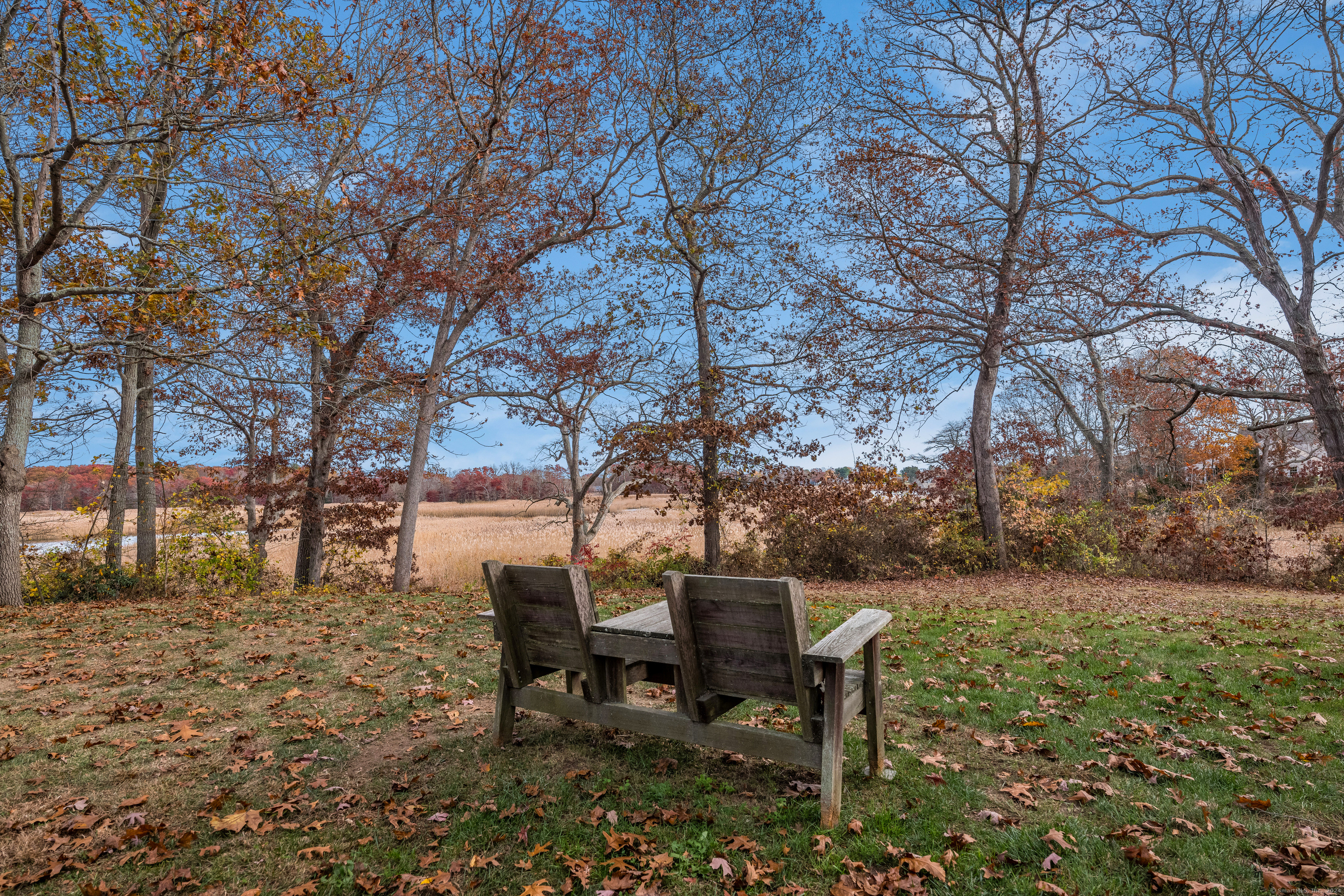 13 Longview Terrace, Unit 13 Madison, CT 06443 - Photo 27 of 31 a view of a outdoor space with table and chair