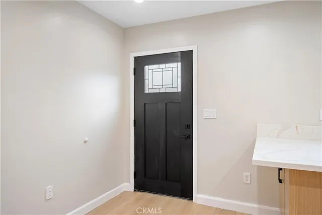 a kitchen with stainless steel appliances a refrigerator and a stove top oven
