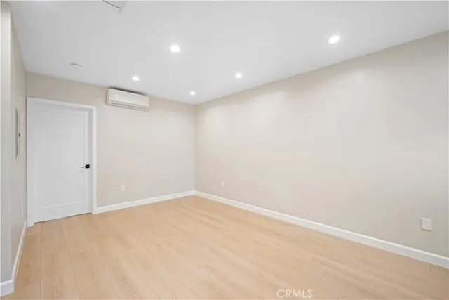 a kitchen with stainless steel appliances granite countertop a refrigerator a sink and a stove