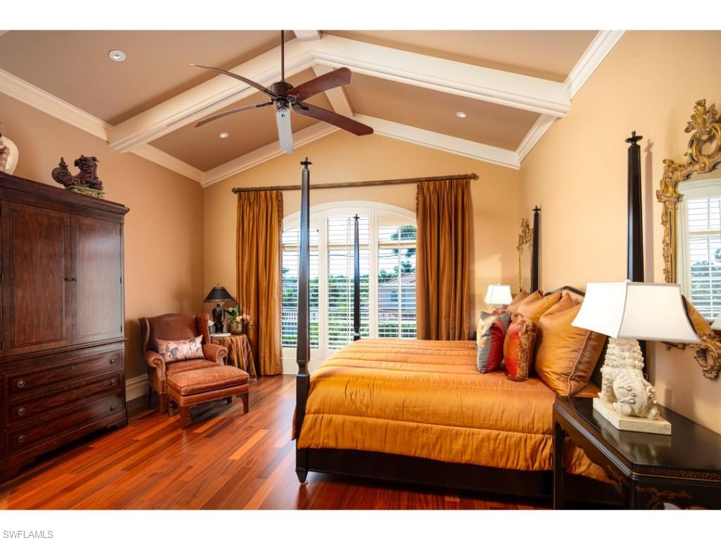 1979 4th Street South Naples, FL 34102 - Photo 13 of 22 a bedroom with a bed and wooden floor