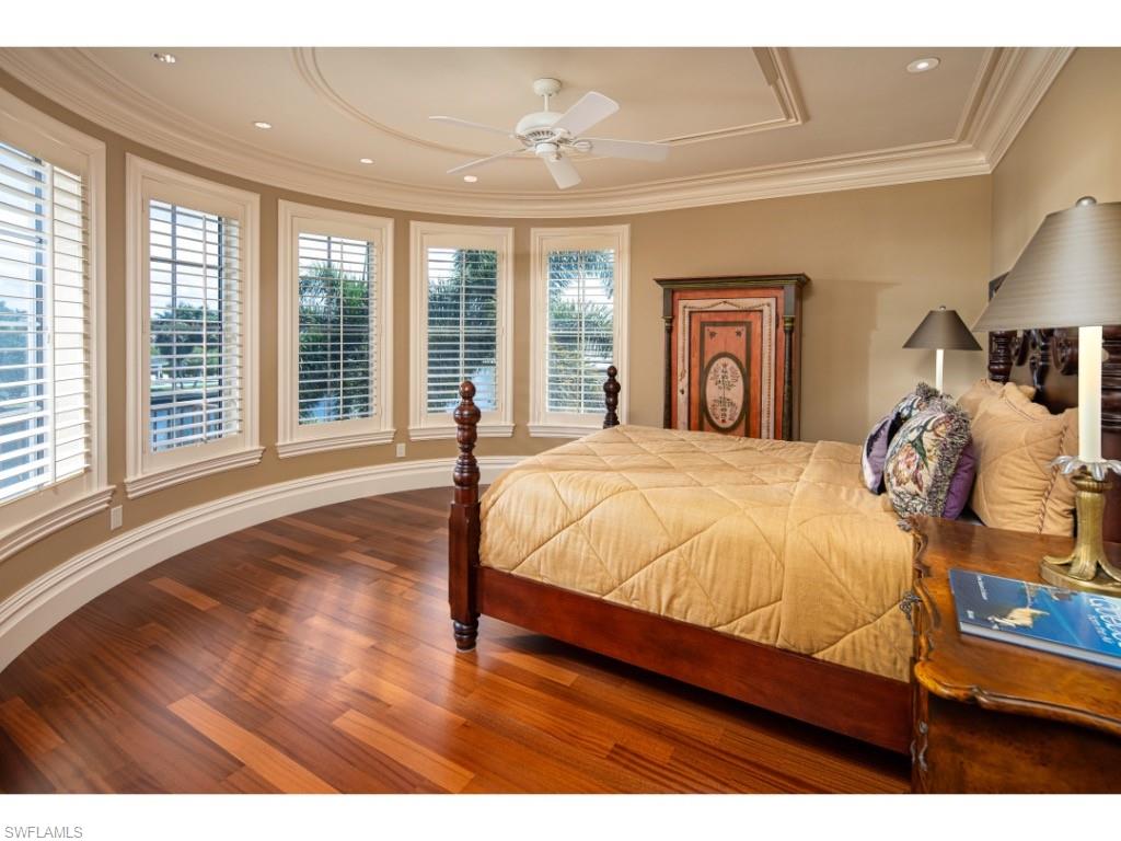 1979 4th Street South Naples, FL 34102 - Photo 15 of 22 a bedroom with a large bed and a large window