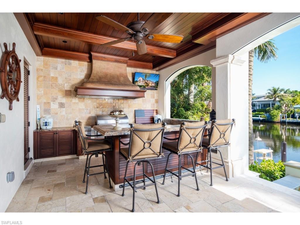 1979 4th Street South Naples, FL 34102 - Photo 17 of 22 a dining space with furniture and outdoor view
