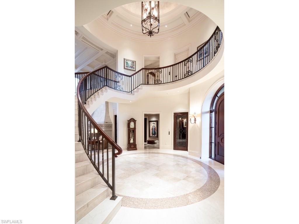 1979 4th Street South Naples, FL 34102 - Photo 2 of 22 a view of a hallway with a chandelier and entryway