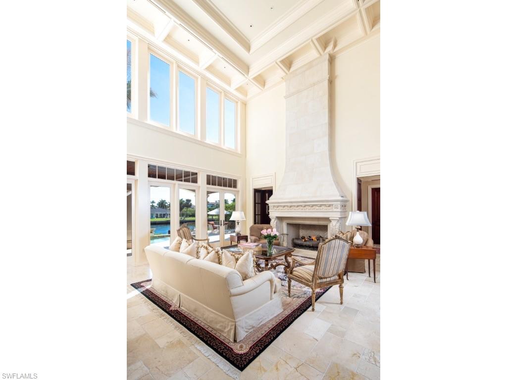 1979 4th Street South Naples, FL 34102 - Photo 3 of 22 a living room with fireplace furniture and a large window