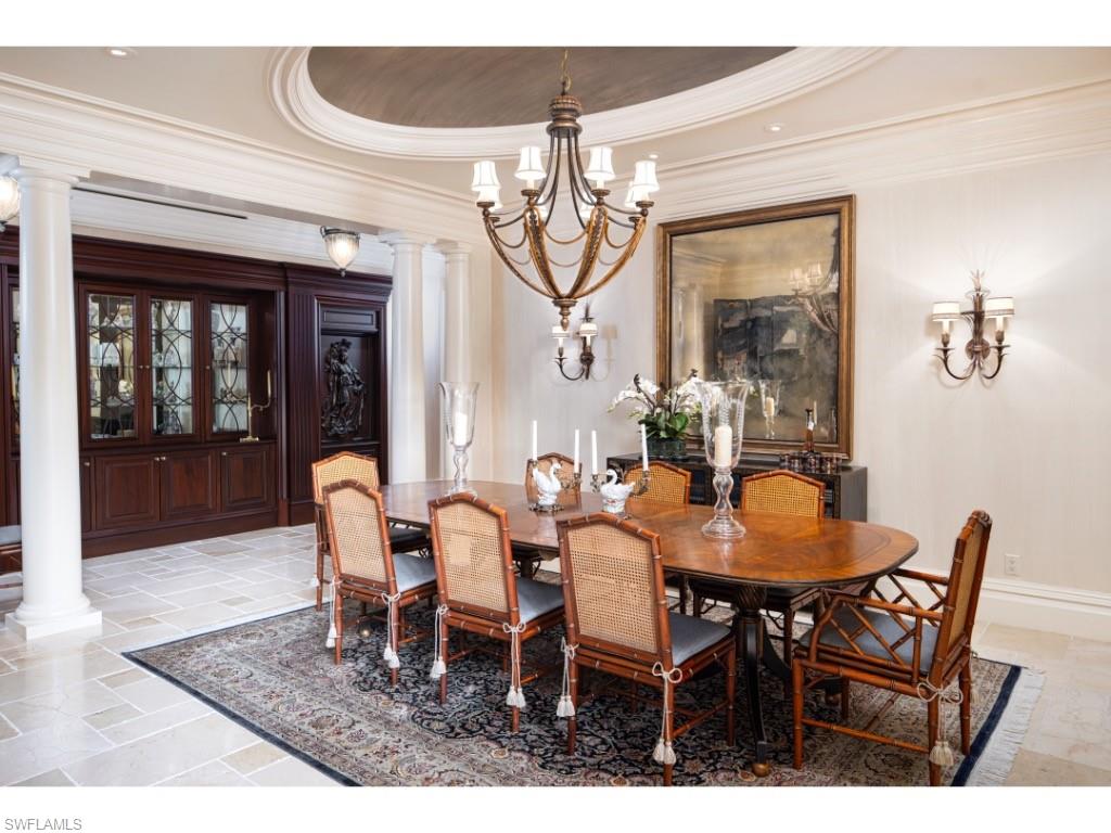 1979 4th Street South Naples, FL 34102 - Photo 6 of 22 a dining room with furniture a chandelier and wooden floor