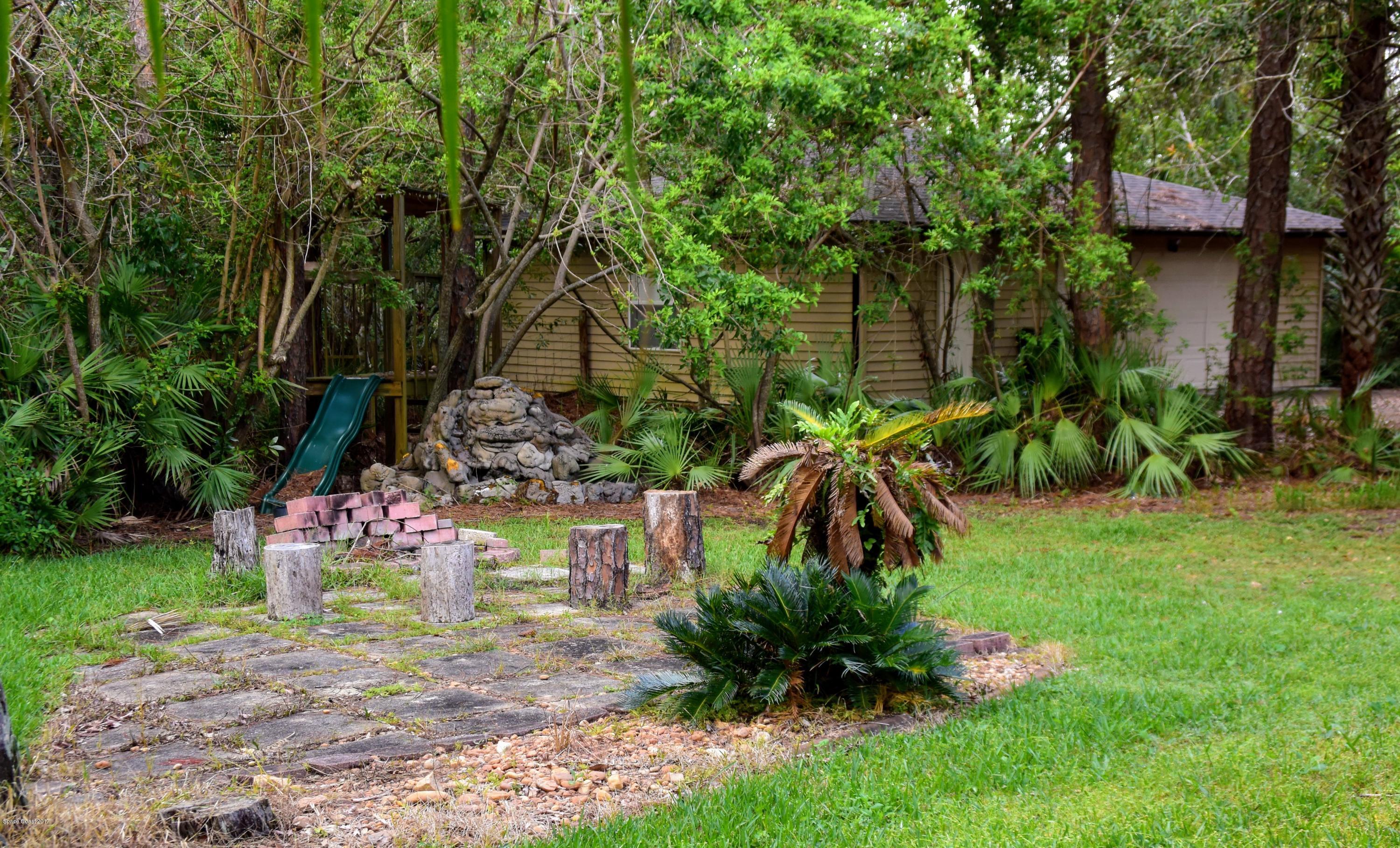 1560 Hidden Wood Road Cocoa, FL 32926 - Photo 24 of 35 Fire Pit & Play area