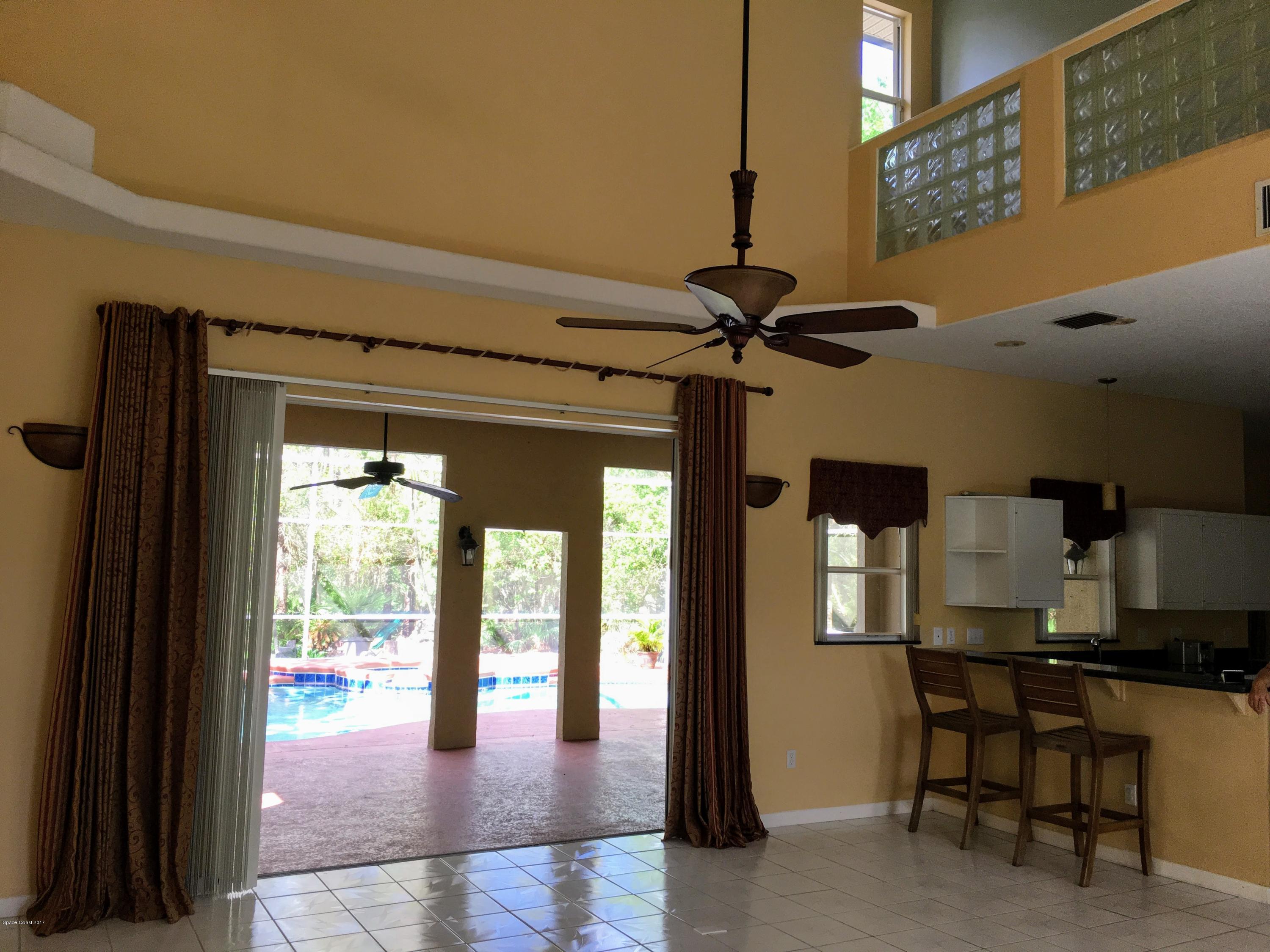 1560 Hidden Wood Road Cocoa, FL 32926 - Photo 5 of 35 Great Room & Kitchen
