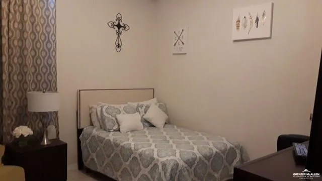 a bedroom with a bed and a table