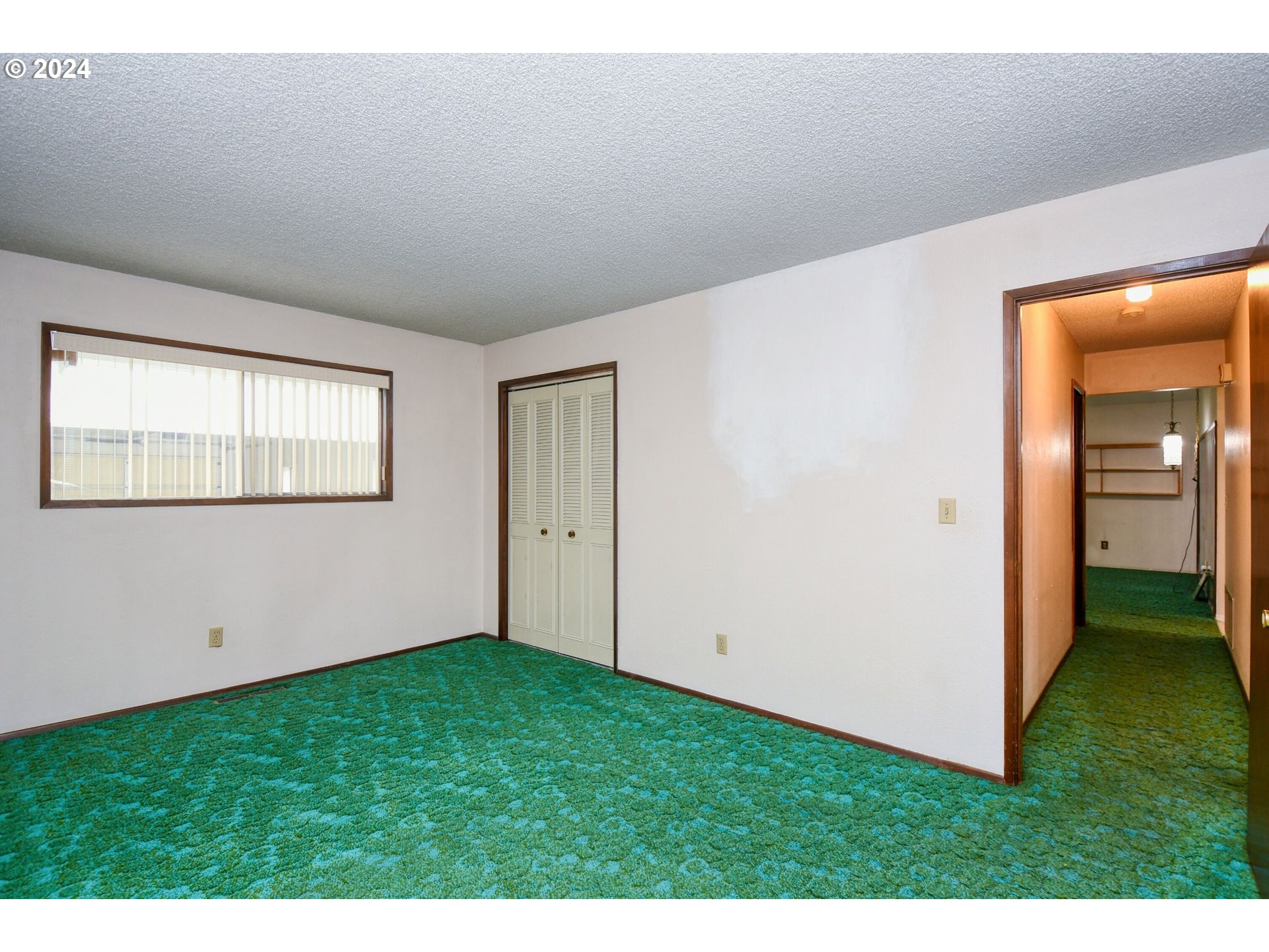 1209 Zeta Court Pendleton, OR 97801 - Photo 17 of 48 a view of an empty room with closet and a window