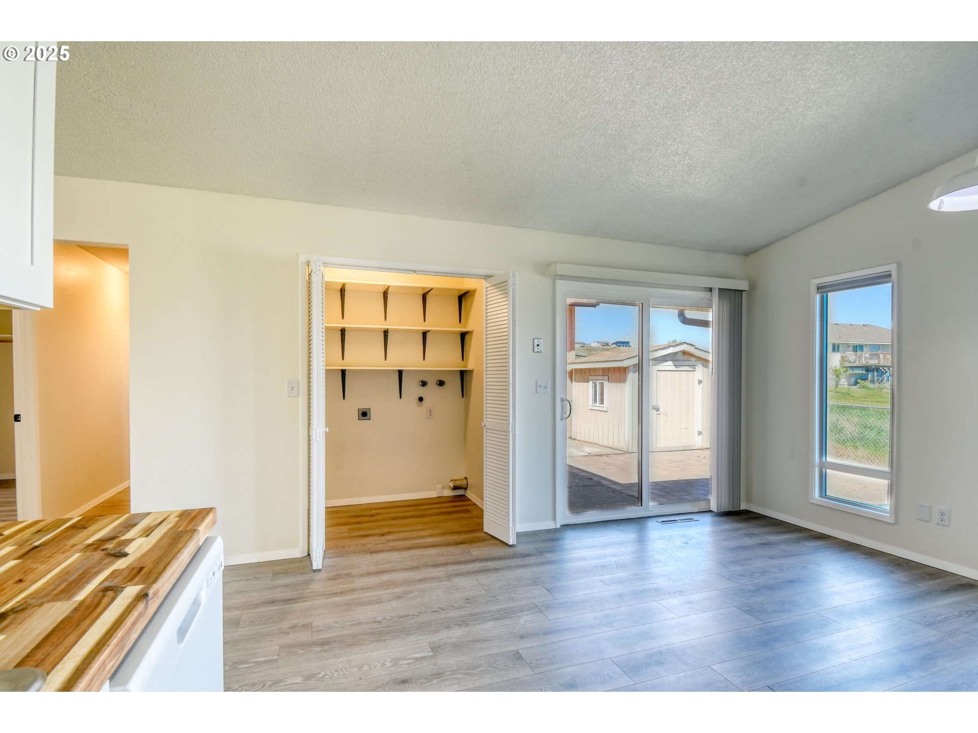 1209 Zeta Court Pendleton, OR 97801 - Photo 35 of 48 a view of an empty room with wooden floor and a window