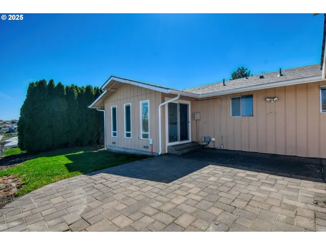 a view of a big yard with a building