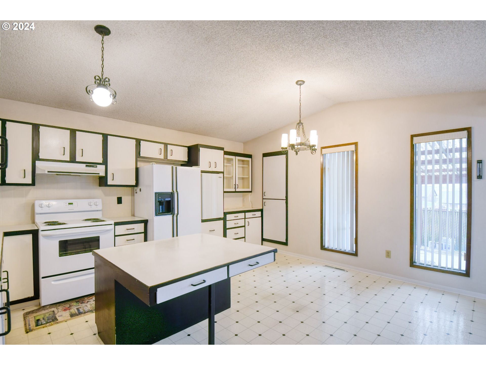 1209 Zeta Court Pendleton, OR 97801 - Photo 10 of 48 a kitchen view with appliances a sink cabinets and a window