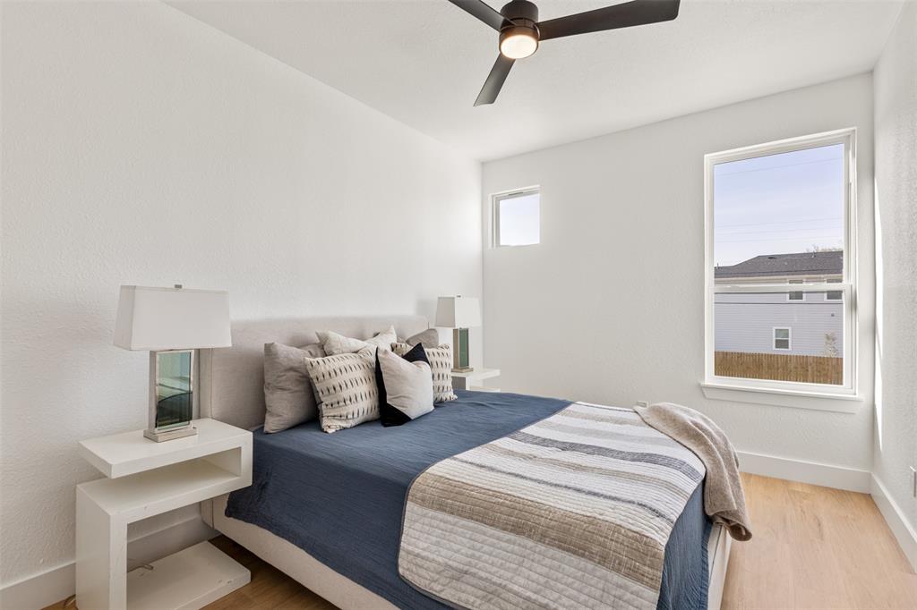 3524 Spring Avenue Dallas, TX 75210 - Photo 21 of 29 Bedroom with light wood-type flooring and a ceiling fan