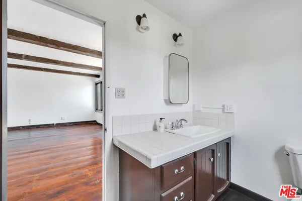 a view of backyard with a small garden