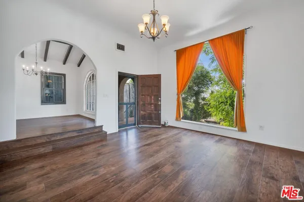 a view of a room with window wooden floor and livingroom