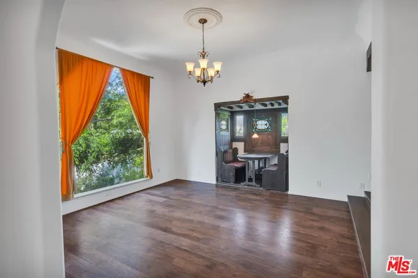 a front view of a house with fountain