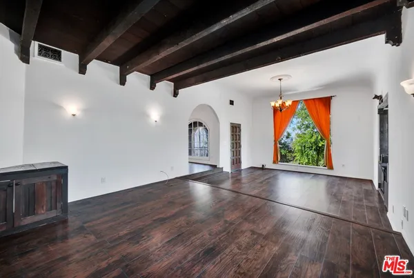a kitchen with a stove a sink and a refrigerator