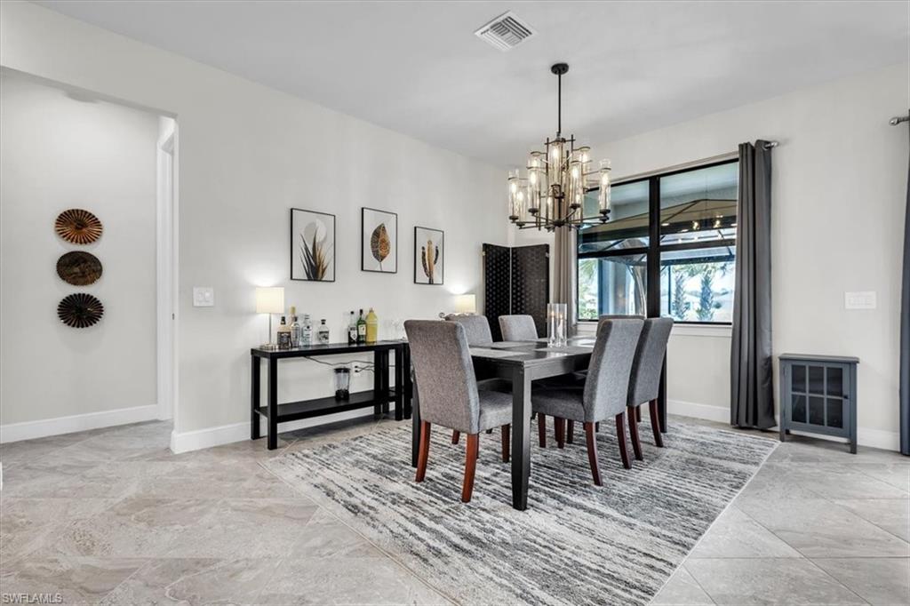 3032 Walnut Grove Lane Alva, FL 33920 - Photo 13 of 49 a view of a dining room with furniture and window