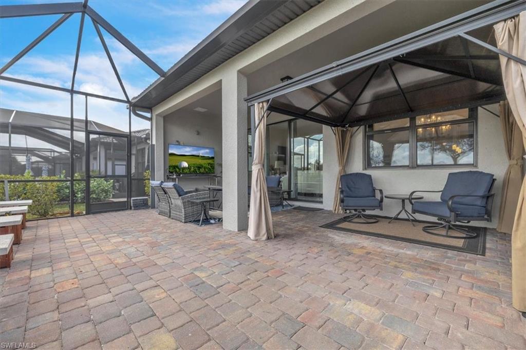 3032 Walnut Grove Lane Alva, FL 33920 - Photo 33 of 49 a view of a chairs and table in backyard of a house